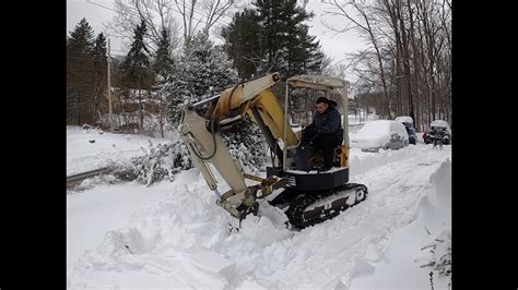 can you plow snow with a mini excavator|mini x snow removal.